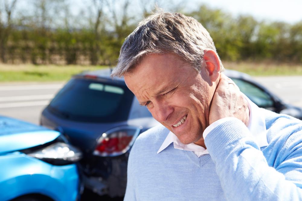 man having neck pain after auto accident